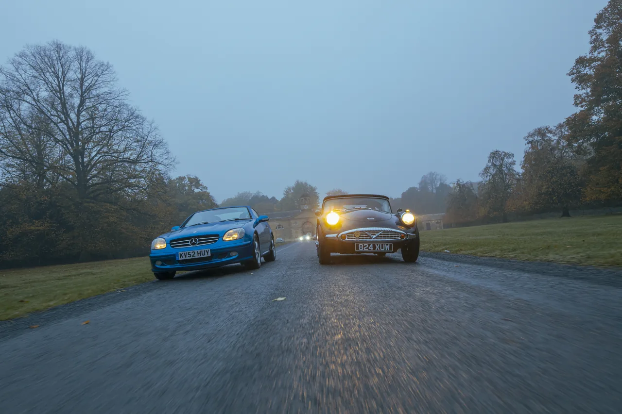 Two sporting cars photographed travelling together