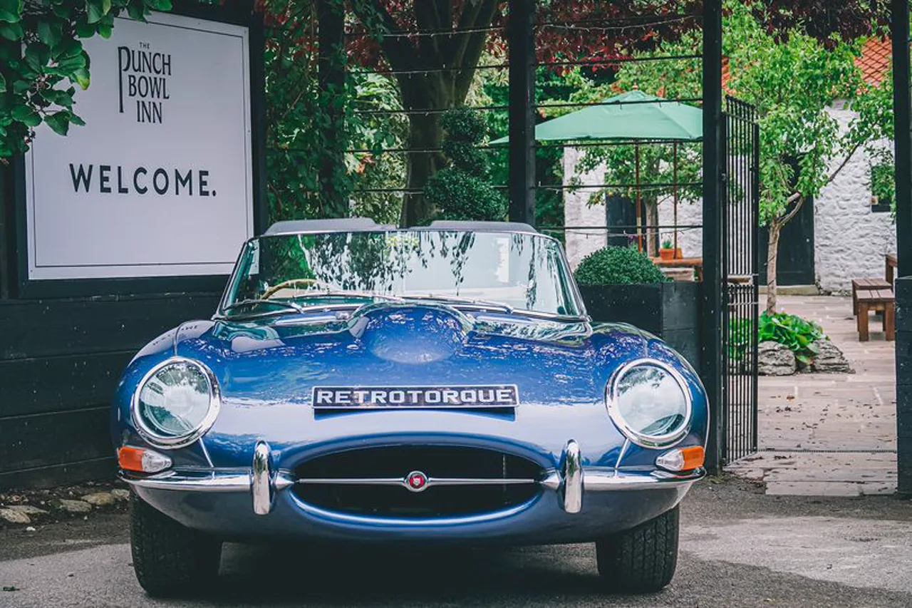 Blue Jaguar E-Type with RetroTorque plate outside The Punch Bowl Inn